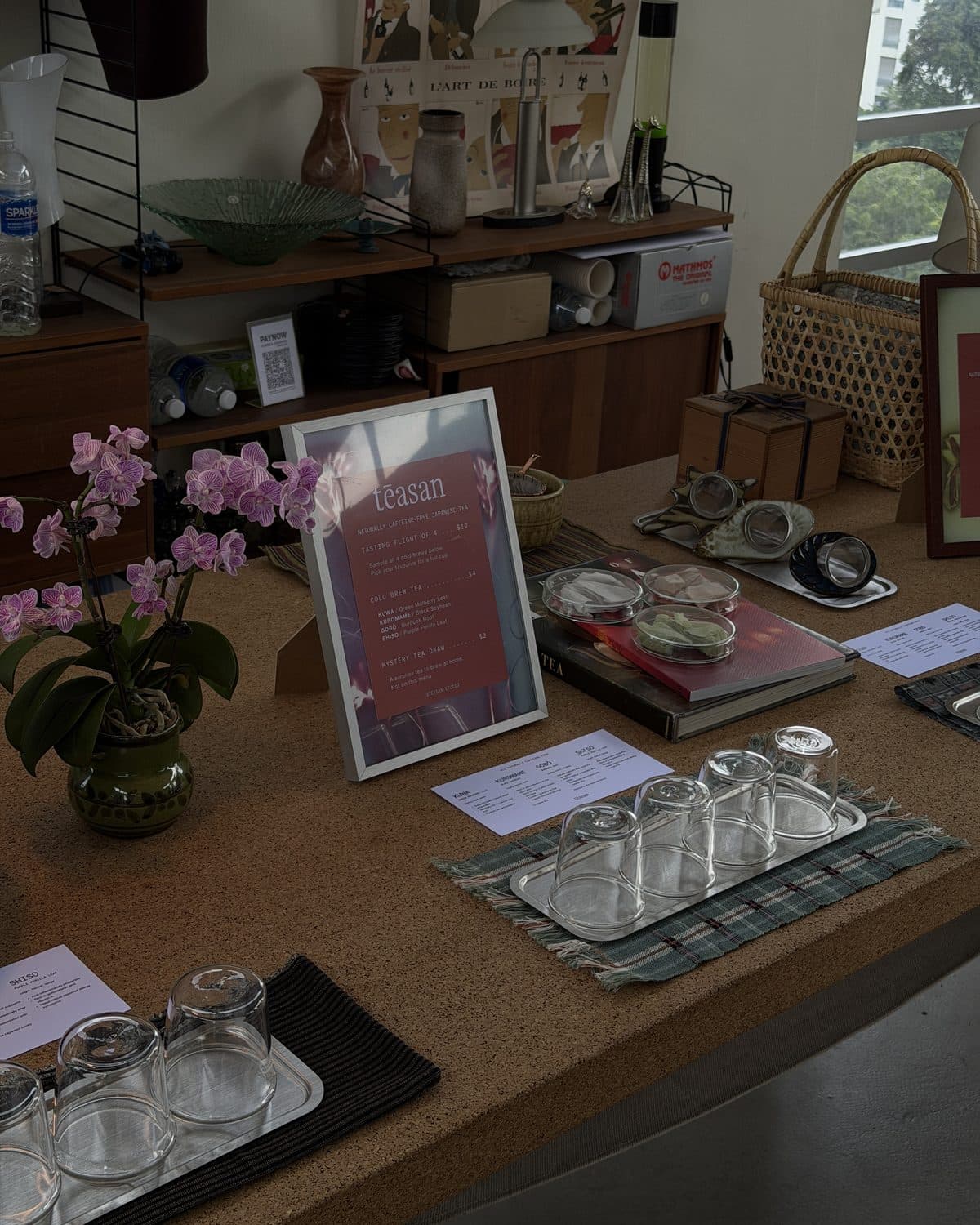 Glass tasting flights and a Teasan menu set out on the table before a tasting